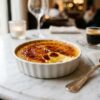 Classic crème brûlée with caramelized sugar crust in ramekin