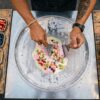 Thai rolled ice cream being freshly prepared on a cold plate